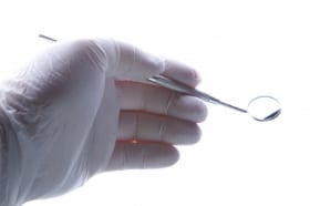 dentist holding mirror